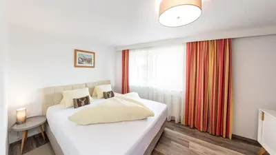 Ein Bett oder Betten in einem Zimmer der Unterkunft Hotel Garni & Appartements Ilgerhof