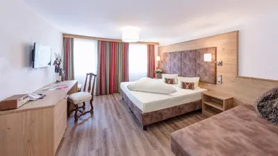 Ein Bett oder Betten in einem Zimmer der Unterkunft Hotel Garni & Appartements Ilgerhof