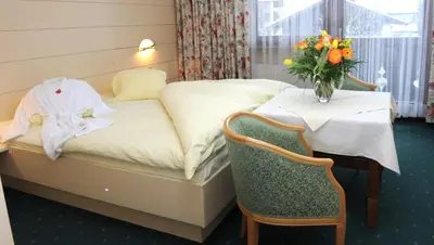 Ein Bett oder Betten in einem Zimmer der Unterkunft Hotel Garni & Appartements Ilgerhof
