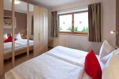 Ein Bett oder Betten in einem Zimmer der Unterkunft Appartementhaus Charisma