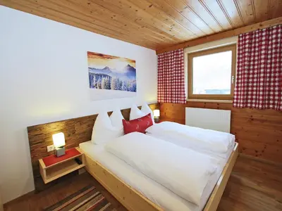 Ein Bett oder Betten in einem Zimmer der Unterkunft Spacious Holiday Home near Ski Area in Kaltenbach