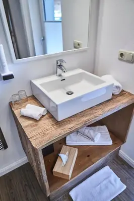 Ein Badezimmer in der Unterkunft Hotel Schachner