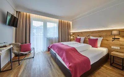 Ein Bett oder Betten in einem Zimmer der Unterkunft Hotel Schachner
