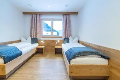 Ein Bett oder Betten in einem Zimmer der Unterkunft Aberghof