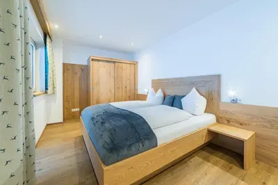 Ein Bett oder Betten in einem Zimmer der Unterkunft Aberghof