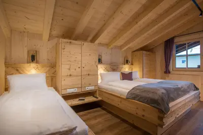 Ein Bett oder Betten in einem Zimmer der Unterkunft Alpenchalet Stadlpoint