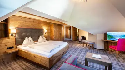 Ein Bett oder Betten in einem Zimmer der Unterkunft Hotel Sendlhof