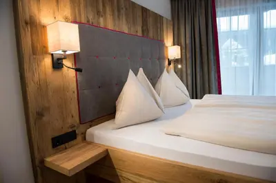 Ein Bett oder Betten in einem Zimmer der Unterkunft Hotel Sendlhof