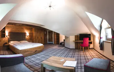 Ein Bett oder Betten in einem Zimmer der Unterkunft Hotel Sendlhof