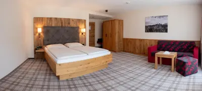 Ein Bett oder Betten in einem Zimmer der Unterkunft Hotel Sendlhof