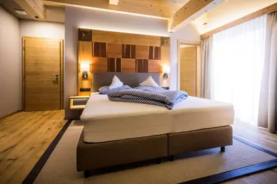 Ein Bett oder Betten in einem Zimmer der Unterkunft Flora - Das kleine Gartenhotel