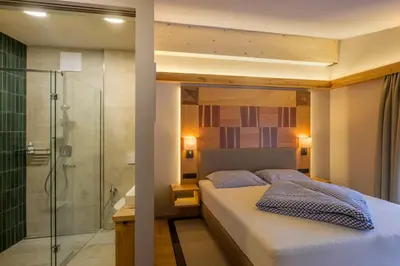 Ein Bett oder Betten in einem Zimmer der Unterkunft Flora - Das kleine Gartenhotel
