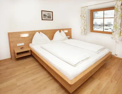 Ein Bett oder Betten in einem Zimmer der Unterkunft Tarlack Appartements Hütten 34