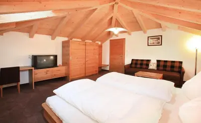Ein Bett oder Betten in einem Zimmer der Unterkunft Tarlack Appartements Hütten 34