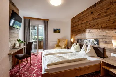 Ein Bett oder Betten in einem Zimmer der Unterkunft Hotel Apart Garni Heisenhof