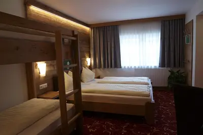Ein Bett oder Betten in einem Zimmer der Unterkunft Hotel Apart Garni Heisenhof