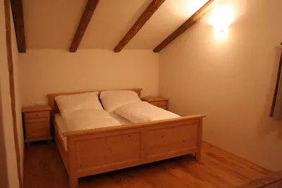 Ein Bett oder Betten in einem Zimmer der Unterkunft Chalet Alte Mühle