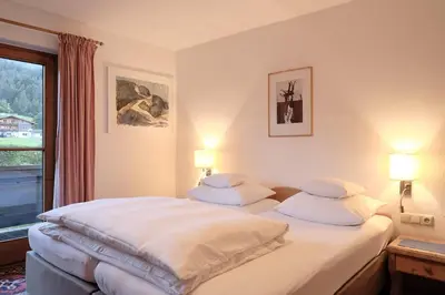 Ein Bett oder Betten in einem Zimmer der Unterkunft Pension Landhaus Gasteiger