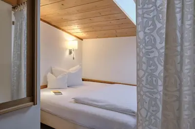 Ein Bett oder Betten in einem Zimmer der Unterkunft Pension Landhaus Gasteiger