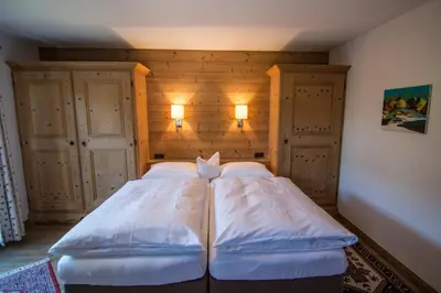 Ein Bett oder Betten in einem Zimmer der Unterkunft Pension Landhaus Gasteiger