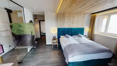 Ein Bett oder Betten in einem Zimmer der Unterkunft Hotel Panther'A