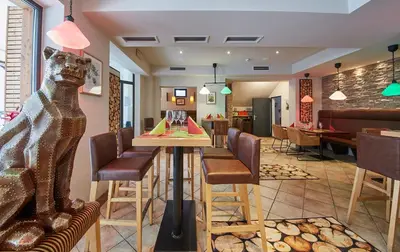 Ein Sitzbereich in der Unterkunft Hotel Panther'A