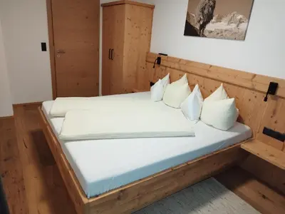 Ein Bett oder Betten in einem Zimmer der Unterkunft Apart Gerlossteinblick
