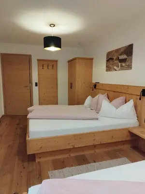 Ein Bett oder Betten in einem Zimmer der Unterkunft Apart Gerlossteinblick