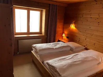 Ein Bett oder Betten in einem Zimmer der Unterkunft Ferienwohnungen Max Schermer