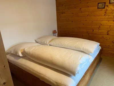 Ein Bett oder Betten in einem Zimmer der Unterkunft Ferienwohnungen Max Schermer