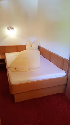 Ein Bett oder Betten in einem Zimmer der Unterkunft Glaserhof