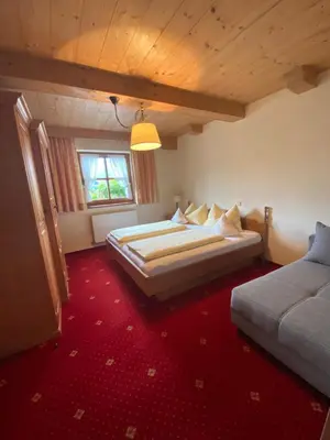 Ein Bett oder Betten in einem Zimmer der Unterkunft Gästehaus Grauss