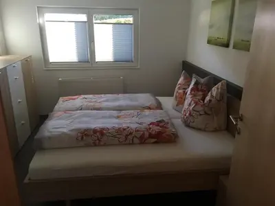 Ein Bett oder Betten in einem Zimmer der Unterkunft Ferienwohnung Mauracher Kirer Haus