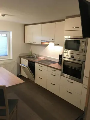 Küche/Küchenzeile in der Unterkunft Ferienwohnung Mauracher Kirer Haus