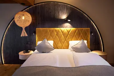 Ein Bett oder Betten in einem Zimmer der Unterkunft Sporthotel Ellmau in Tirol