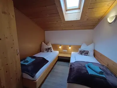 Ein Bett oder Betten in einem Zimmer der Unterkunft Appartement Catrin mit Sauna und E-Ladestation