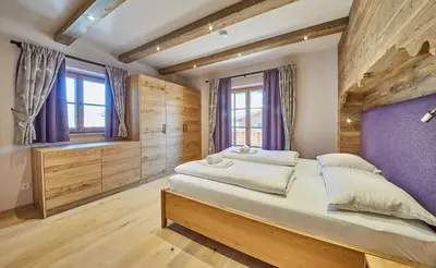 Ein Bett oder Betten in einem Zimmer der Unterkunft Chalet Guter Hirte