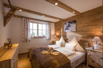 Ein Bett oder Betten in einem Zimmer der Unterkunft Reiterbauer Chalets & Ferienwohnungen