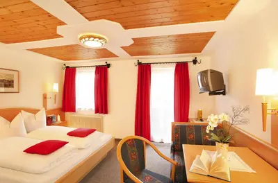 Ein Bett oder Betten in einem Zimmer der Unterkunft Appartement Hotel Garni Matthäuserhof