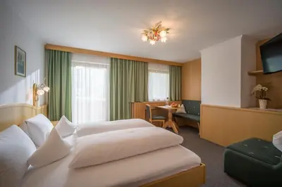 Ein Bett oder Betten in einem Zimmer der Unterkunft Appartement Hotel Garni Matthäuserhof