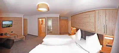 Ein Bett oder Betten in einem Zimmer der Unterkunft Hotel Birkenhof