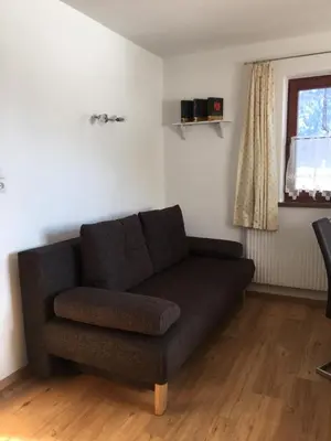 Ein Sitzbereich in der Unterkunft Bauernhof Hinterfirst