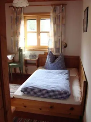 Ein Bett oder Betten in einem Zimmer der Unterkunft Bergpension Zinting