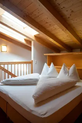 Ein Bett oder Betten in einem Zimmer der Unterkunft Aparthotel Schindlhaus/Alpin