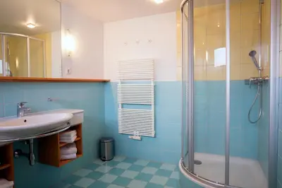 Ein Badezimmer in der Unterkunft Aparthotel Schindlhaus/Alpin