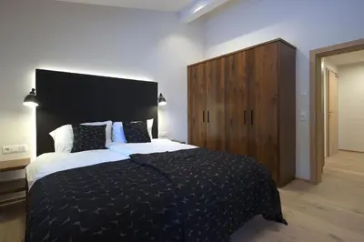 Ein Bett oder Betten in einem Zimmer der Unterkunft Alpin Penthouse Hollersbach