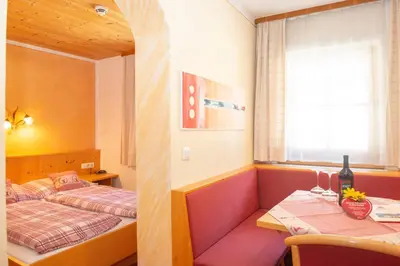 Ein Bett oder Betten in einem Zimmer der Unterkunft Ferienwohnungen Starchenthof - Wildschönau, Premiumcard inclusive