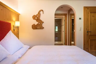 Ein Bett oder Betten in einem Zimmer der Unterkunft Gästehaus Stotter