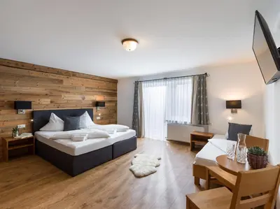 Ein Bett oder Betten in einem Zimmer der Unterkunft Tennenwirt Guesthouse - Adults only