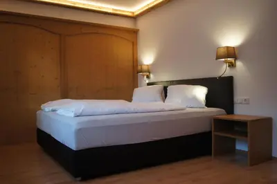 Ein Bett oder Betten in einem Zimmer der Unterkunft Tennenwirt Guesthouse - Adults only